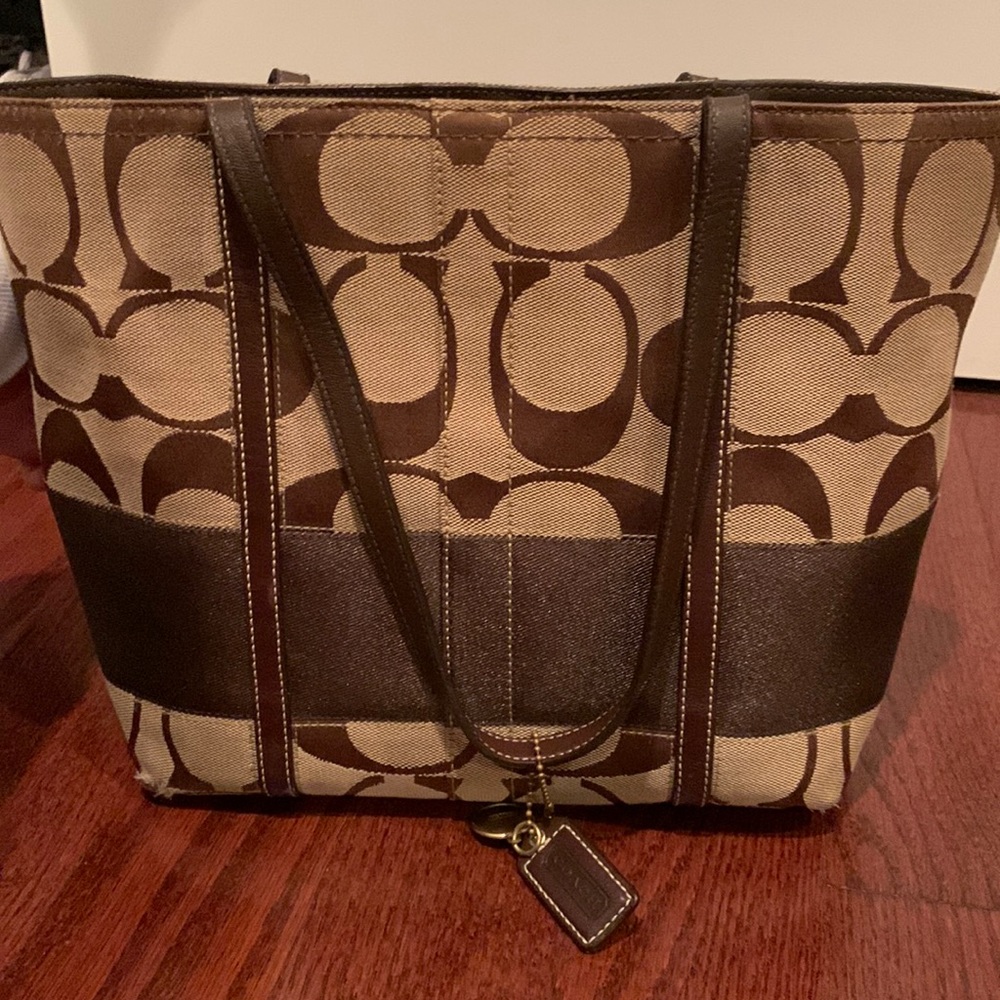 Signature Coach fabric tote purse with colorful striped interior